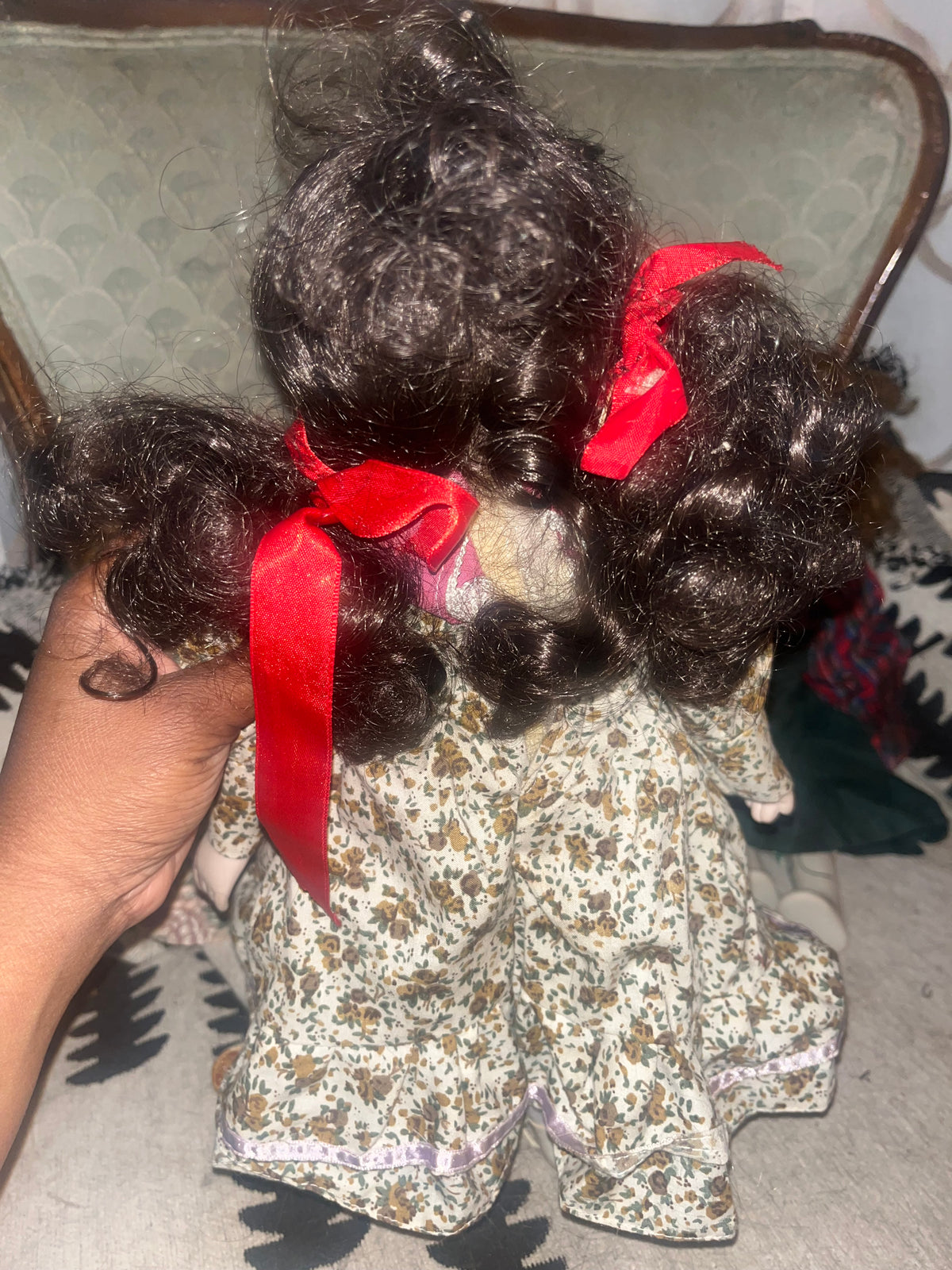Vintage Porcelain Doll in Floral Dress with Red Ribbon Pigtails